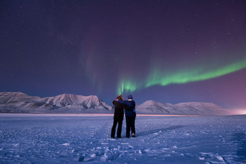 Wall Mural - the polar arctic northern lights aurora borealis sky star in norway svalbard in longyearbyen city ma