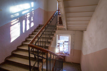 Poster - staircase overlap. old railing at the stairs. the old steps in the house.