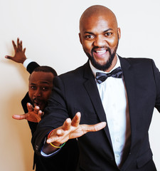 two afro-american businessmen in black suits emotional posing, g