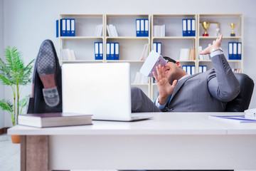 Businessman with virtual reality glasses in modern technology co