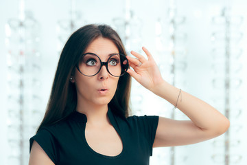 Canvas Print - Funny Girl Looking for New Eyeglasses in Optical Store