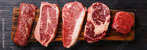 Fotomural Variety of Raw Black Angus Prime meat steaks Machete, Blade on bone, Striploin,
