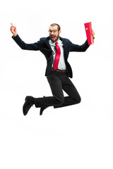 Wall Mural - Funny cheerful businessman jumping in air over white background