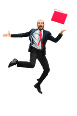 Wall Mural - Funny cheerful businessman jumping in air over white background