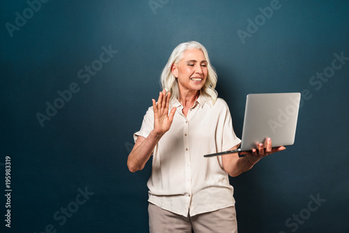 Happy Mature Old Woman Using Laptop Computer Waving Buy This
