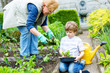 © Irina Schmidt - Cute little preschool kid boy and grandmother planting green salad in spring