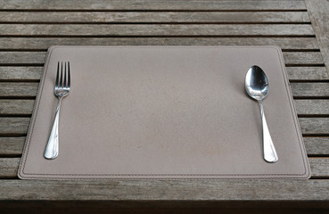 Close-up Empty table with spoon and fork in the restaurant.
