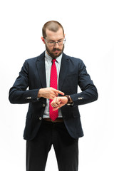 Wall Mural - businessman looking at his watch on his hand, watching the time