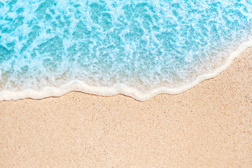 Soft wave of blue ocean on sandy beach with copy space fr text. Summer Background.