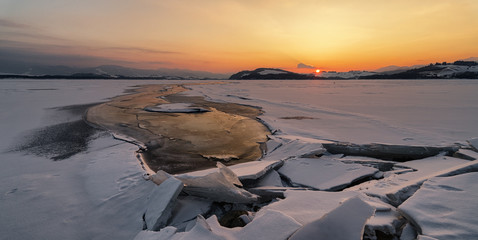 Wall Mural - Colorful twilight over frozen lake