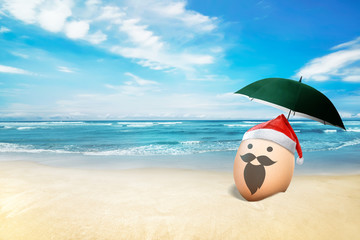 Wall Mural - Egg with santa hat in the beach