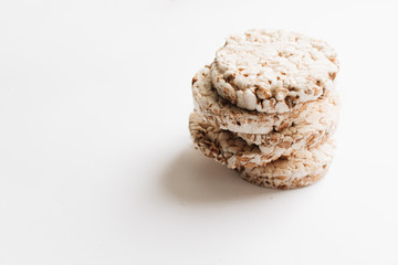 Crisp bread slices isolated over white background, healthy breakfast