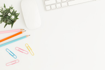 Wall Mural - flat lay photo of office desk with mouse and keyboard white copy space with pencil top view