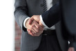 © ASDF - Business men giving a handshake. Business concept