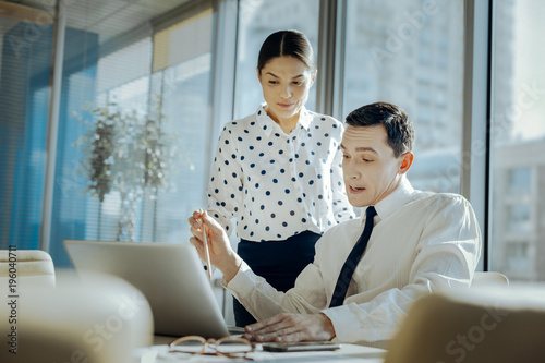 Searching For Appraisal Pleasant Young Man Showing His Female Boss The Presentation Of His New Business Project And Waiting For Her Reaction A Bit Worriedly Stock Photo Adobe Stock