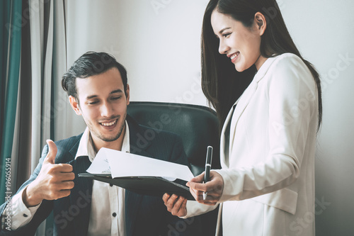Fotomural Business boss is giving compliment to secretary report