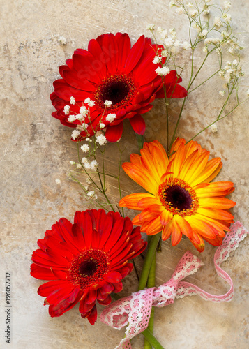 A bouquet of gerbera flower on a stone background or slate with copy space Poster Mural XXL