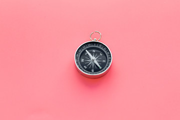 Wall Mural - Compass on pink background top view copy space