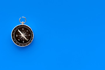 Wall Mural - Direction concept with compass on blue background top view mockup