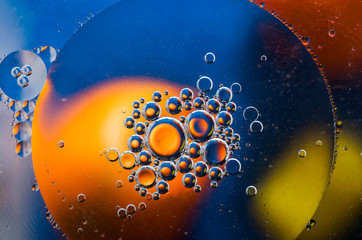 Oil drops on water surface abstract background