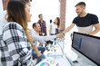 © ASDF - handshake of colleagues in a creative office.