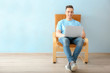 © Africa Studio - Young man using laptop indoors