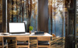 Mock up of wooden desk, laptop with white blank scrreen ,smartphone  and boooks in modern house with pine forest background outside