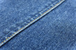 Close up blue jean texture background with seam decoration thread layer