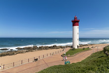  Lighthouse Against Blue Cloudy Coastal Seascape In South Africa