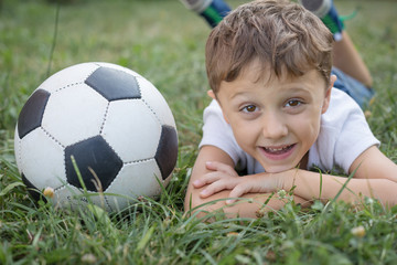 Portrait of a young  boy with soccer ball.