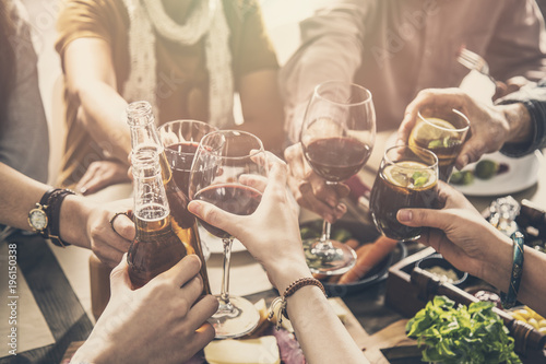 Cuadros en Lienzo Group of people having meal togetherness dining toasting glasses
