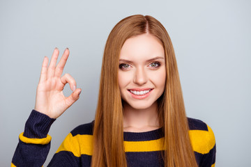 Trend university style vogue concept. Close up portrait of excited confident cheerful cute lovely attractive beautiful with long straight hairdo making ok symbol isolated on gray background