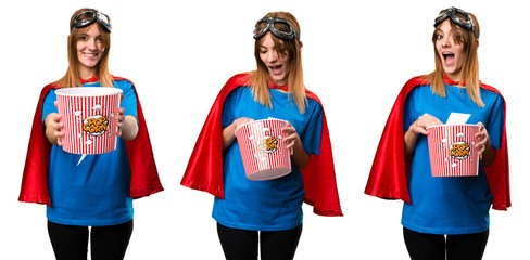 Wall Mural - Pretty superhero girl eating popcorns