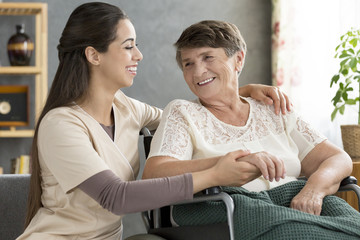 Sticker - Nurse supporting happy elderly woman