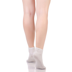 Wall Mural - Female legs in white beige cotton socks