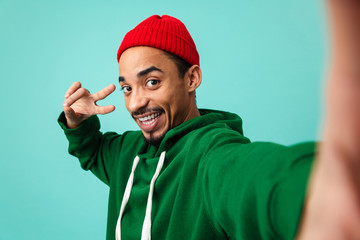 Poster - Portrait of a smiling young afro american man in hat