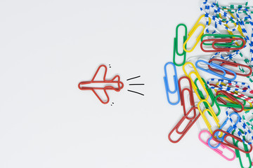 business concept for group of stacked paperclip with another one red plane paperclip is point to ano