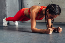 Side View Of Fit Woman Doing Plank Core Exercise.