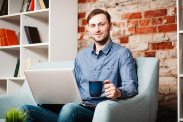 Canvas Print - Young man with a laptop