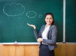 © stockartstudio - a young teacher shows an idea near the board