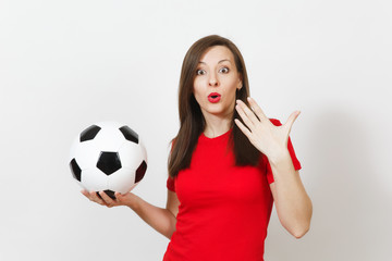 Wall Mural - Beautiful European young cheerful happy woman, football fan or player in red uniform holding classic soccer ball isolated on white background. Sport, play football, health, healthy lifestyle concept.