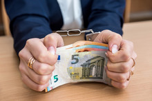 Financial Crime Concept - Female Hands With Handcuffs And Euro Bills
