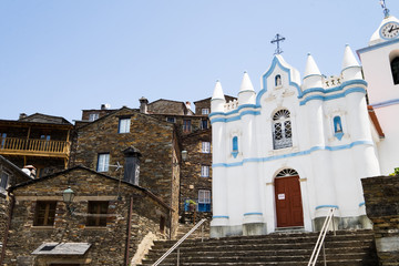 church with traditional historical houses in Piodao, Portugal