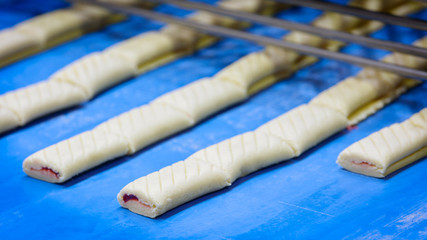 Poster - Bars cakes buns cookies on production line background, Dessert, sweets for tea. Fattening sweets concept
