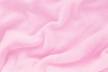Fluffy Gentle Baby Pink Fabric With Waves And Folds. Soft Pastel Textile Texture. Folds On The Soft Fabric. Rose Towel Terry Cloth.