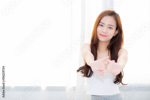 Fotografie, Obraz Beautiful young asian woman stretch and relax in bed after wake up morning at bedroom, new day and resting for wellness, lifestyle concept