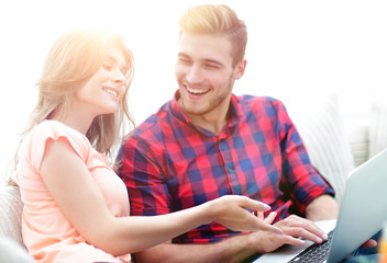 closeup of young couple with laptop