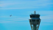 Barcelona Airport Radar Traffic Control Tower.
Air Traffic Control Tower At Barcelona Airport With Flying Plane In Sky.
Airport Control Tower At Full Capacity.
