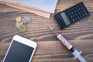 Wall Mural - marketing strategy concept. Medicine syringe with liquid inside and inscribtion.