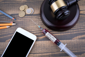 Wall Mural - social media concept. medicine syringe with liquid inside and inscribtion.